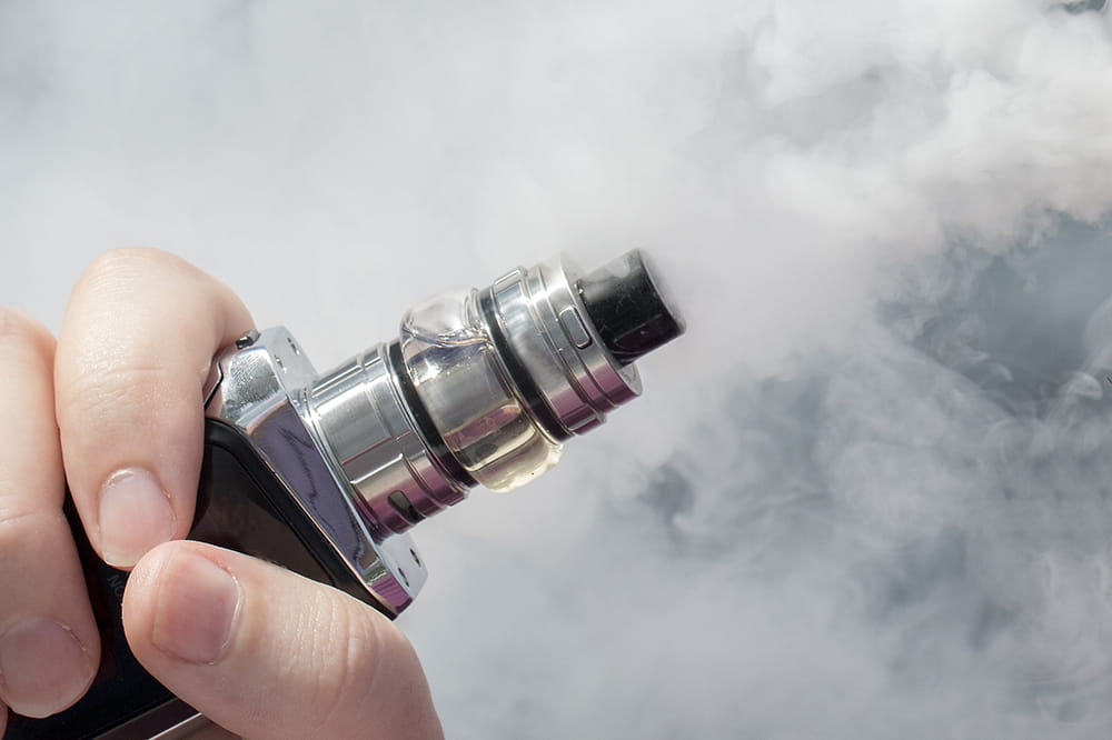 fingers holding e-cigarette